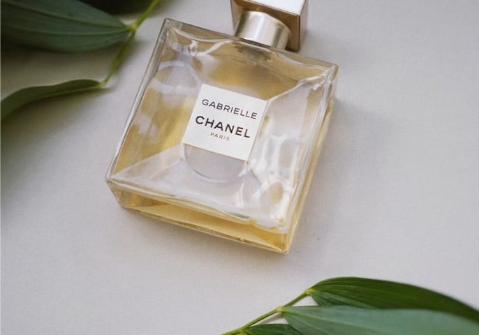 Chanel perfume and leaves